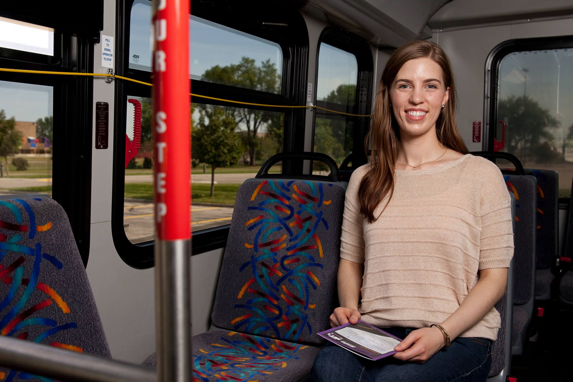 Young woman riding a Dial-A-Ride bus